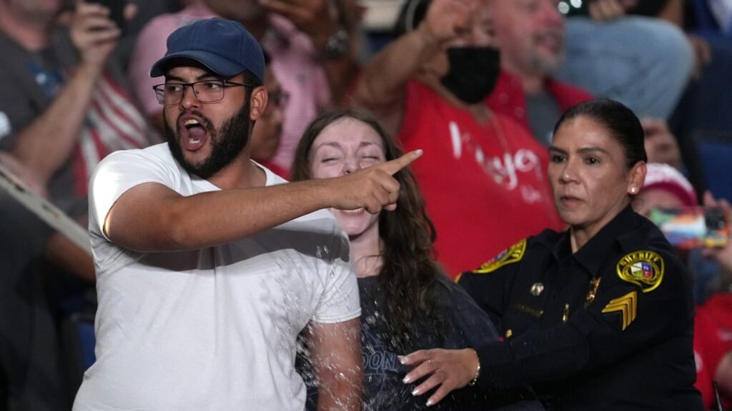 Trump interrupted by protesters as he fights to rally Texas voters